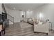 Bright living room with hardwood floors and comfortable seating arrangement at 5625 Axil Ln, Charlotte, NC 28269