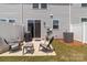 Back patio with outdoor seating and a grill, situated beside a privacy fence and the home at 5625 Axil Ln, Charlotte, NC 28269