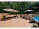 Spacious deck featuring comfortable seating, a bar, and a relaxing ambiance, ideal for outdoor gatherings and leisure at 5764 Grassy Creek Rd, Denver, NC 28037