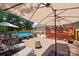 Spacious backyard featuring an in-ground pool, deck with outdoor seating, and a fire pit for entertaining at 5764 Grassy Creek Rd, Denver, NC 28037