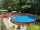Refreshing above-ground pool with surrounding deck and lounge area, ideal for backyard entertainment and relaxation at 5764 Grassy Creek Rd, Denver, NC 28037