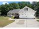 Charming ranch home with a two-car garage, well-manicured lawn, and a sidewalk leading to the front door at 5764 Grassy Creek Rd, Denver, NC 28037