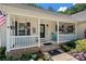 Inviting front porch with comfortable seating and decorative details, creating a welcoming entrance to the home at 5764 Grassy Creek Rd, Denver, NC 28037