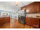 Bright kitchen featuring stainless steel appliances, hardwood floors, and granite countertops at 5764 Grassy Creek Rd, Denver, NC 28037