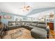Spacious living room featuring a large sectional sofa, hardwood floors, and vaulted ceiling at 5764 Grassy Creek Rd, Denver, NC 28037