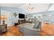 Comfortable living room featuring a leather sofa, hardwood floors, and a vaulted ceiling at 5764 Grassy Creek Rd, Denver, NC 28037