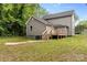 View of the backyard featuring a deck, siding, and grassy area at 60 Valley Nw St, Concord, NC 28025