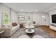 Bright living room with a soft L-shaped couch and modern decor at 60 Valley Nw St, Concord, NC 28025