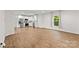 Open-concept living room with modern kitchen and hardwood floors at 60 Valley Nw St, Concord, NC 28025