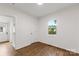 Clean room with wood-look flooring, a window, and neutral walls at 60 Valley Nw St, Concord, NC 28025