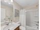 Well-lit bathroom featuring a standard shower-tub combo and a clean, white vanity at 603 Southstone Dr, Matthews, NC 28104