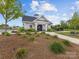 Stylish clubhouse showcasing manicured landscaping and a welcoming entrance, perfect for community gatherings and events at 603 Southstone Dr, Matthews, NC 28104