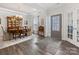 Elegant dining room featuring hardwood floors, a decorative hutch, and stylish furnishings at 603 Southstone Dr, Matthews, NC 28104