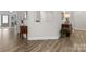 Open hallway with hardwood floors and decorative furnishings creating an inviting atmosphere at 603 Southstone Dr, Matthews, NC 28104
