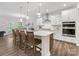 Island kitchen featuring a breakfast bar, white cabinets, subway tile backsplash, and stainless steel appliances at 603 Southstone Dr, Matthews, NC 28104