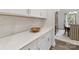 Bright kitchen displays white cabinets, stone countertops, stainless steel handles, and tile backsplash at 603 Southstone Dr, Matthews, NC 28104