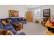 Cozy living area featuring a comfortable sectional sofa and a unique colorful ottoman at 603 Southstone Dr, Matthews, NC 28104