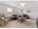 Spacious living room features a comfortable seating arrangement, perfect for entertaining or relaxation at 603 Southstone Dr, Matthews, NC 28104