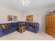 Comfortable living area featuring a sectional sofa and colorful decor, perfect for relaxing and entertaining at 603 Southstone Dr, Matthews, NC 28104