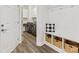 Convenient mudroom featuring bench, storage, and laundry area enhancing functionality at 603 Southstone Dr, Matthews, NC 28104