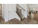 Elegant staircase with wood and wrought iron railing adding a touch of sophistication at 603 Southstone Dr, Matthews, NC 28104