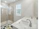 Bathroom features double sinks, a large walk-in shower, and bright natural light at 6037 Chelsea Oaks Rdg # 77, Tega Cay, SC 29708