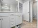 Bathroom features double sinks with white cabinets and a separate toilet and shower at 6037 Chelsea Oaks Rdg # 77, Tega Cay, SC 29708