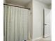 Bathroom with a shower featuring a patterned shower curtain and neutral tile flooring at 6037 Chelsea Oaks Rdg # 77, Tega Cay, SC 29708