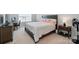 Bedroom features a desk, dresser, and large bed with carpeted floors at 6037 Chelsea Oaks Rdg # 77, Tega Cay, SC 29708