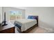 Bedroom features carpeted floors, natural light, and blue decor at 6037 Chelsea Oaks Rdg # 77, Tega Cay, SC 29708