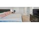 Bright bedroom with carpet features a closet and television atop a dresser at 6037 Chelsea Oaks Rdg # 77, Tega Cay, SC 29708