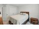 Bedroom featuring a queen-sized bed with wood frame and gray bedding at 6037 Chelsea Oaks Rdg # 77, Tega Cay, SC 29708