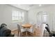 Bright dining area with a round table, chairs, and a large window for natural light at 6037 Chelsea Oaks Rdg # 77, Tega Cay, SC 29708