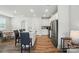 Open-concept kitchen and dining area, featuring a kitchen island with barstool seating at 6037 Chelsea Oaks Rdg # 77, Tega Cay, SC 29708