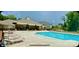 Community pool with ample seating on a sunny day at 6037 Chelsea Oaks Rdg # 77, Tega Cay, SC 29708