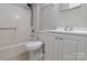 Bathroom featuring a bathtub, toilet, and a sink, designed for functionality and cleanliness at 6124 Old Mt Holly Rd, Charlotte, NC 28208