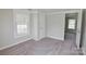Bright bedroom with neutral paint, carpet, and a large window providing ample natural light at 6124 Old Mt Holly Rd, Charlotte, NC 28208