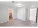 Bedroom with neutral walls, closet, and a glimpse into the utility and bathroom areas at 6124 Old Mt Holly Rd, Charlotte, NC 28208