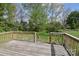 Wooden deck with railings overlooking green backyard at 6124 Old Mt Holly Rd, Charlotte, NC 28208