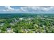 Aerial view showcases the beautiful area with homes nestled among a sea of vibrant green trees and some buildings at 618 Heathermoor Ct, Charlotte, NC 28209