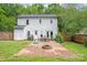 Backyard with a brick patio, fire pit, and outdoor seating, perfect for entertaining and relaxation at 618 Heathermoor Ct, Charlotte, NC 28209