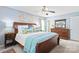 Cozy bedroom features a wooden bed frame, soft bedding, and natural light, creating a comfortable and inviting space at 618 Heathermoor Ct, Charlotte, NC 28209