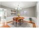 Cozy dining room boasts hardwood floors, stylish decor, and a modern light fixture, creating an inviting atmosphere at 618 Heathermoor Ct, Charlotte, NC 28209