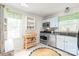 Bright kitchen with stainless steel appliances, granite countertops, and a cozy breakfast nook area near the window at 618 Heathermoor Ct, Charlotte, NC 28209