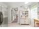 Spacious kitchen features tiled floors and an inviting cottage style hutch, perfect for casual dining and storage at 618 Heathermoor Ct, Charlotte, NC 28209
