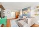 Open living area with a comfortable sofa, hardwood floors, and stylish decorations at 618 Heathermoor Ct, Charlotte, NC 28209