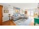Bright living room with a comfortable sectional sofa and stylish decor at 618 Heathermoor Ct, Charlotte, NC 28209