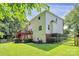 Expansive backyard featuring a deck, mature trees, and privacy, perfect for outdoor living at 655 Powder Horn Ln, Indian Trail, NC 28079