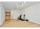 Basement with tiled floors, kitchenette, workout equipment, and plenty of open space at 655 Powder Horn Ln, Indian Trail, NC 28079