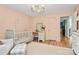 Bright Bedroom showcasing a crib, soft decor, and an adjacent seating area for a comforting atmosphere at 655 Powder Horn Ln, Indian Trail, NC 28079